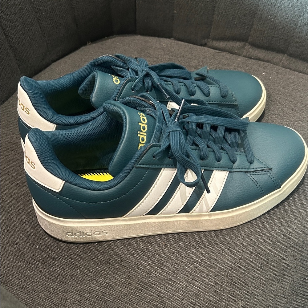 adidas Women’s 8 Teal Sneakers with White Stripes they fit more like an 8.5